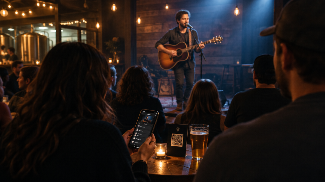 Fans at a live performance scanning a QR code